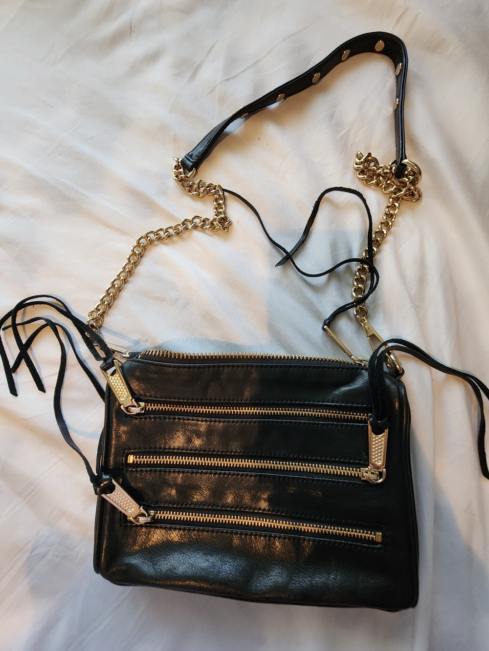 Black Leather Crossbody Bag with Gold Chain Accents